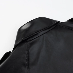 Close-up of premium black faux leather texture and stitching on motor jacket shoulder