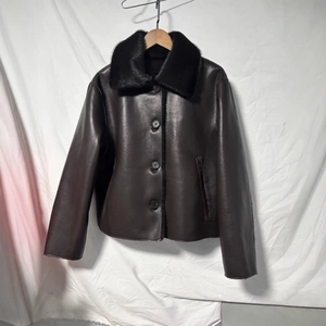 Women winter brown leather jacket with black faux fur collar and button closure