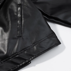 Detail of premium black PU leather jacket showing pockets and reinforced stitching