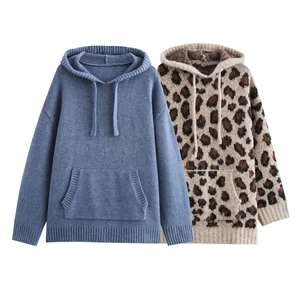 Close-up of knit hoodie detail with animal print and drawstring hooded texture