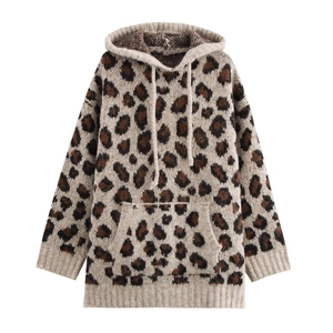 Detail of leopard print knit hoodie featuring a kangaroo pocket and ribbed cuffs
