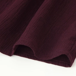 Deep burgundy long sleeve shirt featuring fine knit texture and high quality stitching
