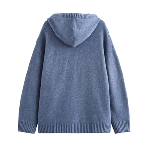 Detail of blue knitted hoodie back view with ribbed cuffs and soft texture fabric