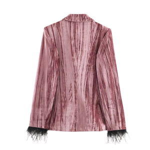 Back view of a dusty rose velvet blazer with elegant black feather trim on the cuffs