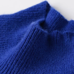 Royal blue long-sleeve knit sweater with high neck and soft wool texture detail