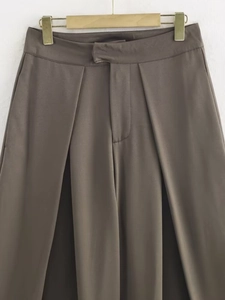 Detail of high waist pleated wide leg trousers in dark coffee brown with belt loops