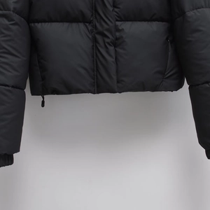 Women's black quilted hooded puffer jacket with adjustable drawstring hem and elastic cuffs