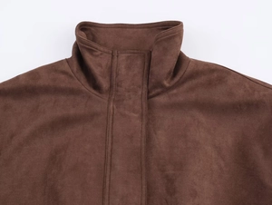 Detail of dark brown suede jacket collar and shoulder with high-quality stitching