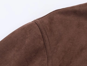 Macro detail of high-quality double-needle stitching on dark brown suede jacket shoulder