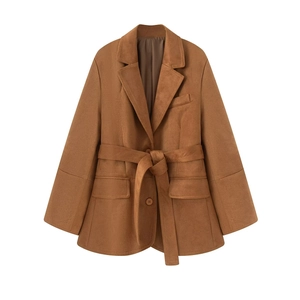 Detail of a brown faux suede blazer with notched lapel and matching belted waist