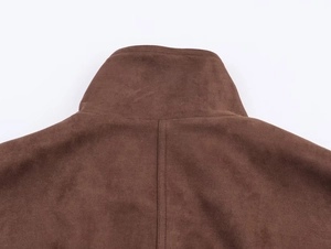 Detailed view of the stand-up collar and premium suede texture on the brown jacket
