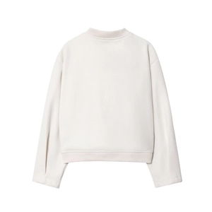 Rear view of cream long sleeve crewneck sweatshirt featuring ribbed cuffs and hem details