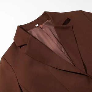 Detail of classic notch lapel on a brown business blazer with smooth silky lining texture