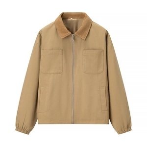 Detail of tan patchwork jacket featuring brown corduroy collar and silver metal zipper