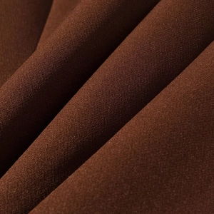 Macro shot of premium dark coffee suit fabric texture with soft drapes and subtle sheen