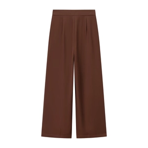 Detail of high-waist wide-leg dress pants in dark brown with smooth suit fabric
