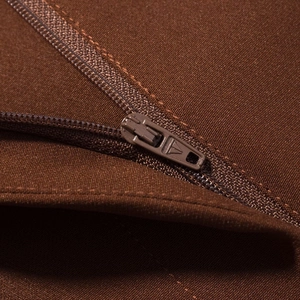 Detail shot of the high-quality zipper and woven fabric texture of the brown suit set