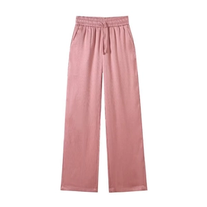 Detail of dusty pink wide-leg trousers with elastic drawstring waist and pleated texture