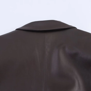 Detailed view of the dark brown PU leather jacket back collar and smooth seam stitching