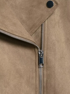 Detail of brown faux suede jacket collar with silver metal zipper and button fastener