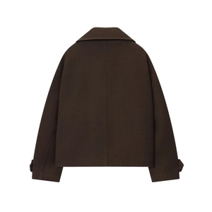 Detail view of the smooth back and dropped shoulders of a brown short wool coat