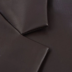 Detailed macro view of espresso PU leather collar with premium natural grain texture