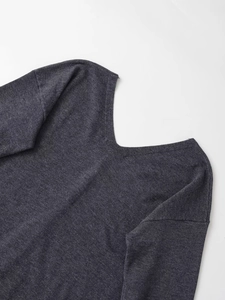 Detail of dark charcoal knit sweater showing the classic V-neck and fine fabric texture