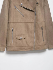 Detail of faux suede biker jacket featuring asymmetric silver zippers and metallic pockets