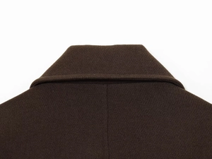 Detailed close-up of dark brown wool coat collar with refined twill weaving texture