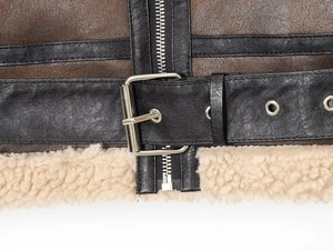 Detail of faux leather jacket featuring silver metal buckle and soft lamb wool lining