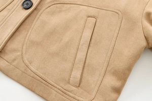 Close-up of the faux suede texture and pocket stitching on this camel brown jacket