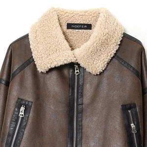 Women's dark brown biker jacket with plush white shearling collar and silver zippers