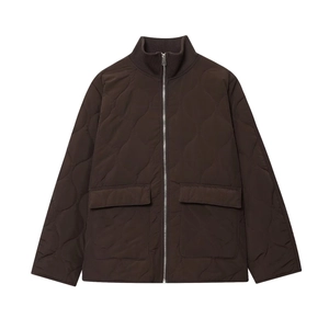 Detail of wave-quilted coffee brown jacket showing rib-knit collar and metal zipper