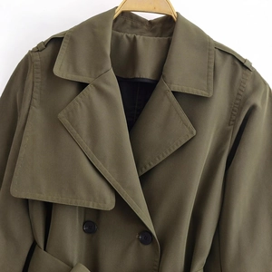 Army green double breasted trench coat with waist belt and notched lapels for women