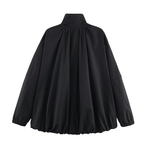 Detail view of high collar bomber jacket featuring ruffled back and oversized silhouette
