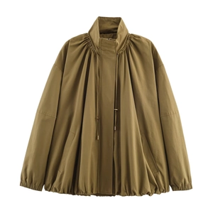 Detail of olive green bomber jacket featuring high collar and pleated shoulder accents