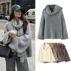 Close-up of oversized ribbed knit sweater featuring a unique high scarf collar design