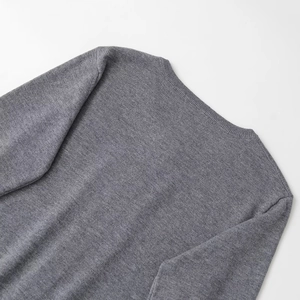 Back view of grey crew neck knit sweater showing ribbed collar and shoulder stitching