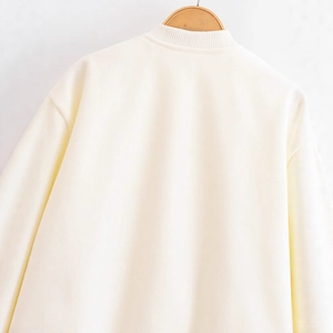 Minimalist ivory stand collar bomber jacket for women featuring a cozy ribbed neckline