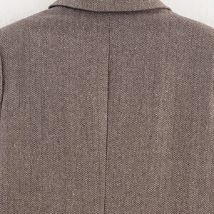 Brown herringbone wool blazer for women featuring a tailored waist and premium stitching