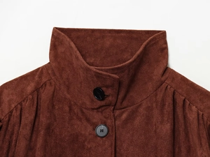 Detail of high stand collar and buttons on a brown faux suede vintage style jacket