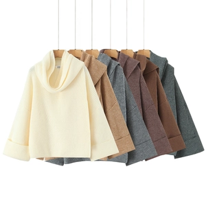 Oversized cowl neck sweaters in multiple neutral tones showing soft knit texture details