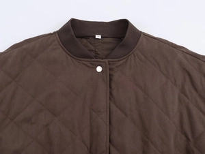 Close-up of quilted coffee bomber jacket with rib knit collar and silver snap buttons