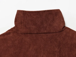 Detail of high collar and soft fleece texture on this brown autumn fashion sweater