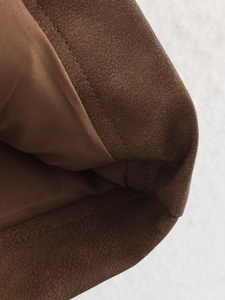 Close-up of the premium dark brown PU jacket fabric and precise stitching detail