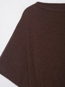 Close-up of brown knit sweater boat neck and soft wool fabric texture detail