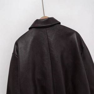 Minimalist oversized faux leather jacket in dark brown featuring premium vintage texture