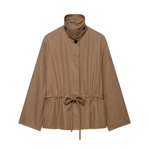 Detail of khaki jacket with adjustable drawstring waist and contrast buttons
