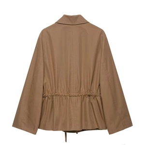 Detail view of the adjustable drawstring waist and back pleats on the khaki parka jacket