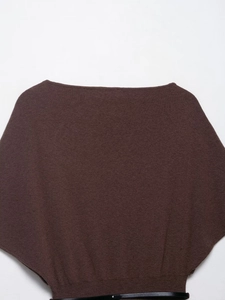 Detail view of brown boat neck knit top featuring fine texture and black slim leather belt